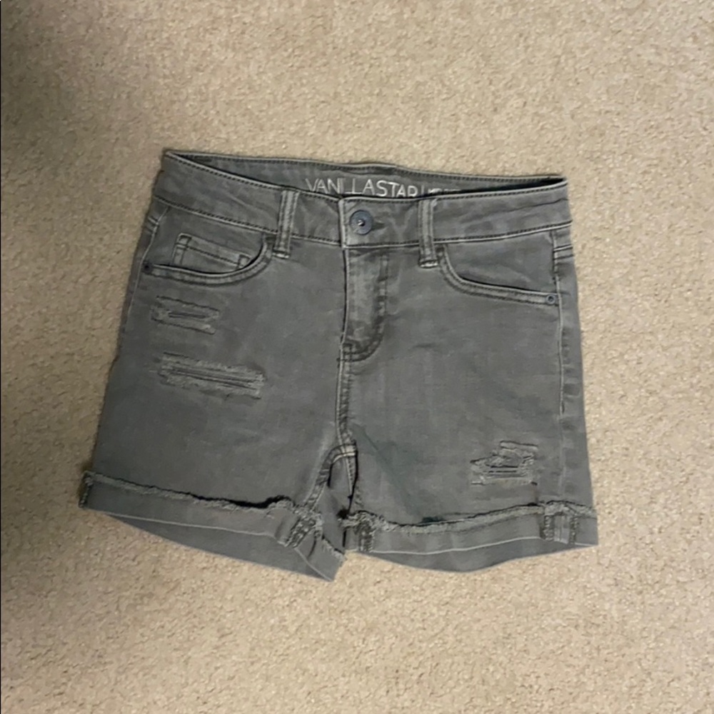Faded green ripped denim shorts
